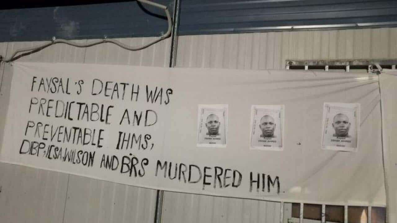 A banner put up during a vigil for Faysal Ishak Ahmed at the Manus Island detention centre