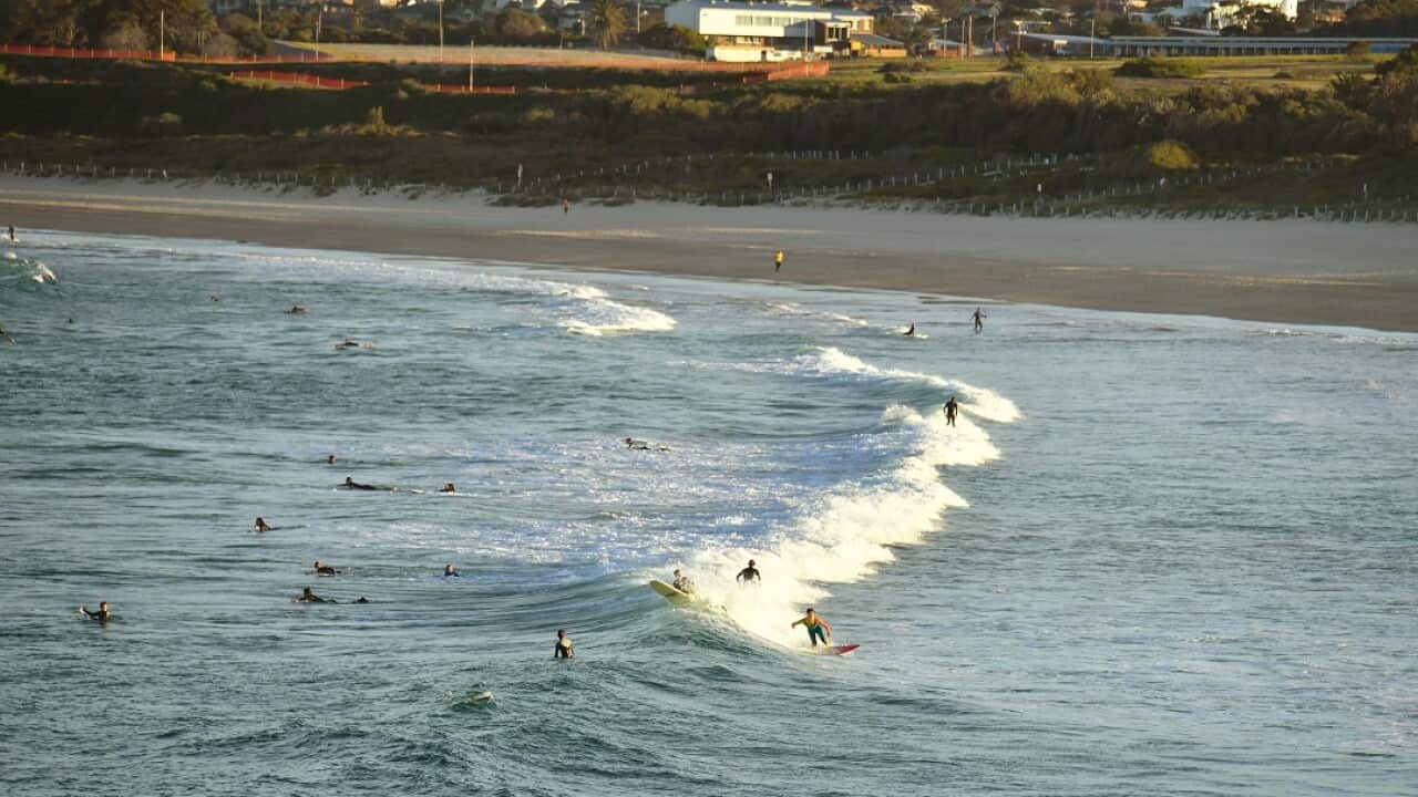 Surfers are seen at sunset at Maroubra Beach in Sydney, Wednesday, July 30, 2018. (AAP Image/Mick Tsikas) NO ARCHIVING