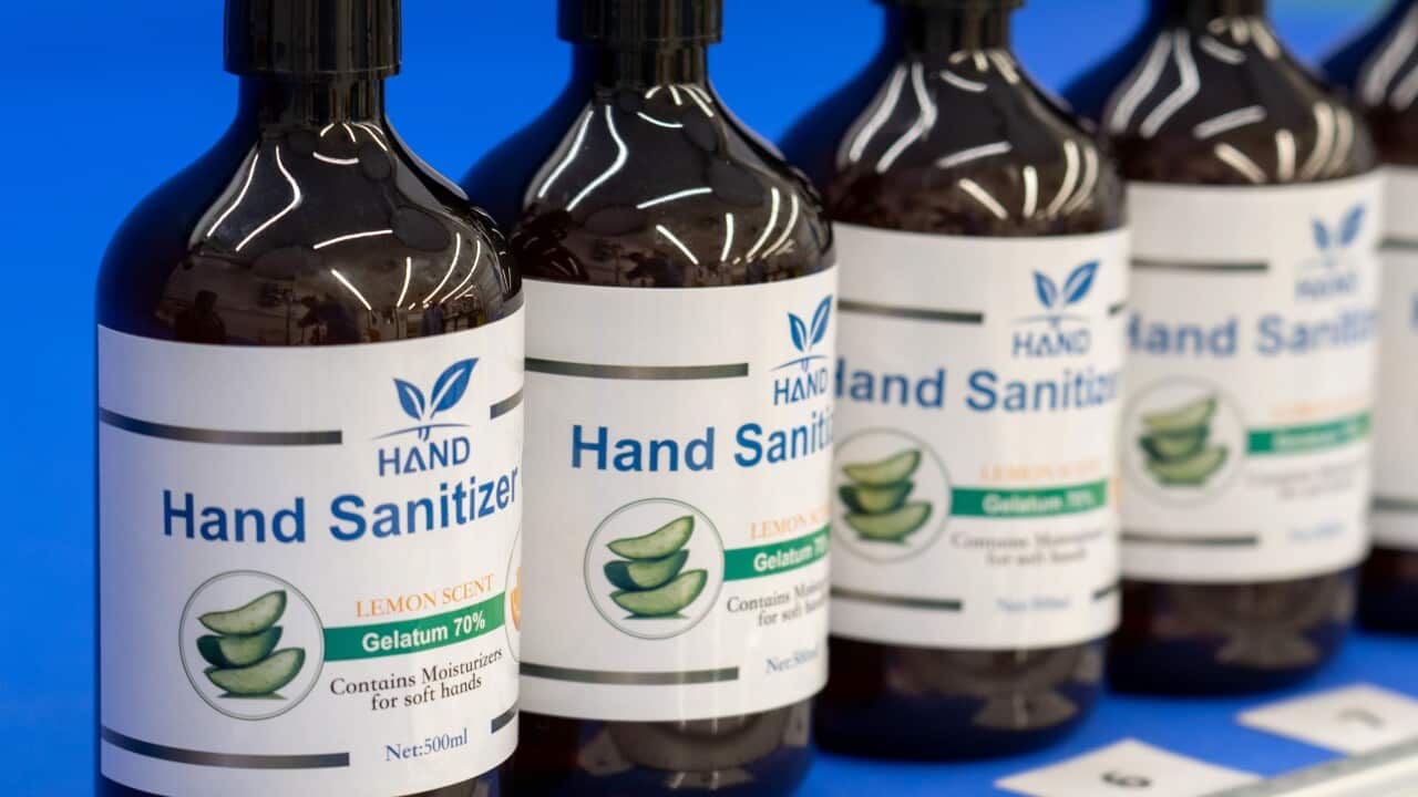 A row of hand sanitiser bottles.