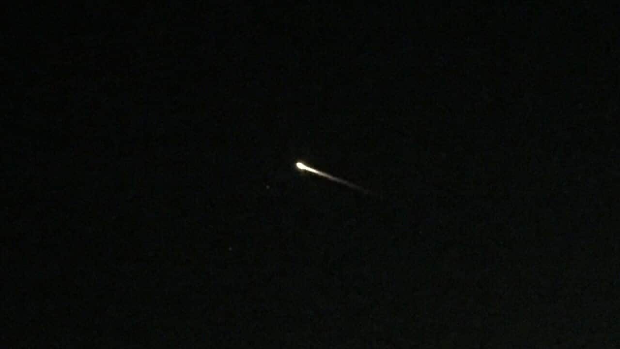 A streak of light is seen over an apartment complex in Las Vegas.