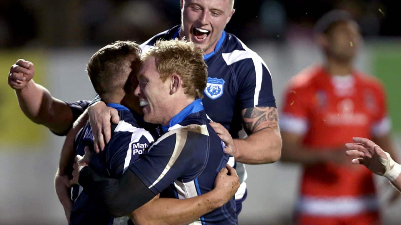 Scotland's Matthew Russell (L) celebrates scoring a try