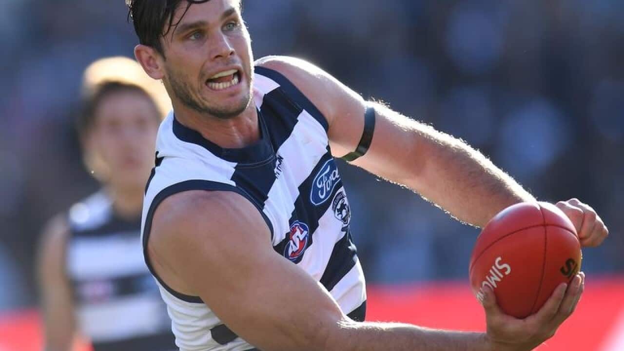 Tom Hawkins of the Cats is seen in action against the Lions.