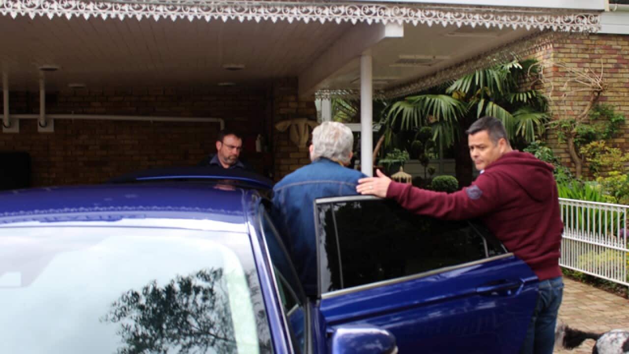 Australian entertainer Rolf Harris (C)