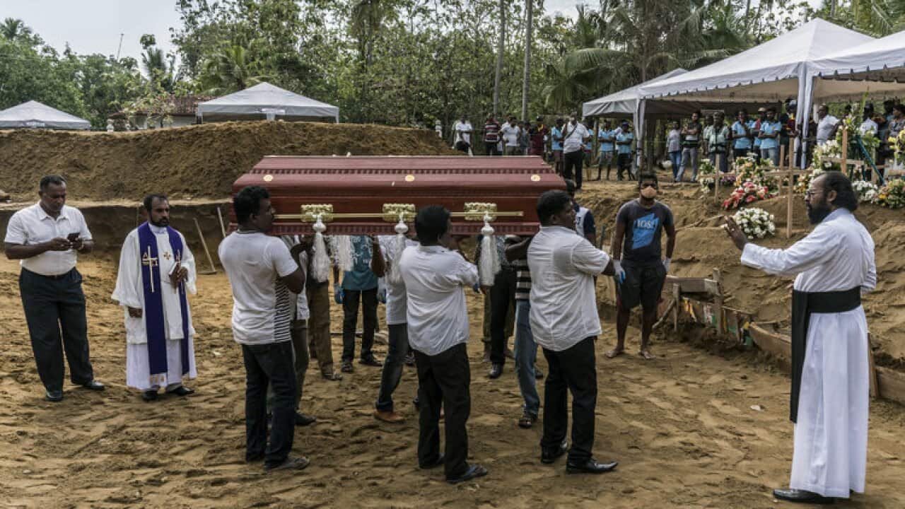 Sri Lankans bury their dead in the wake of the attack.