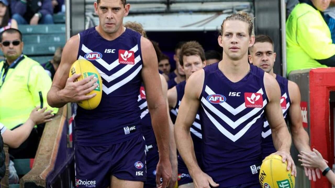 Aaron Sandilands of the Dockers and Nat Fyfe.
