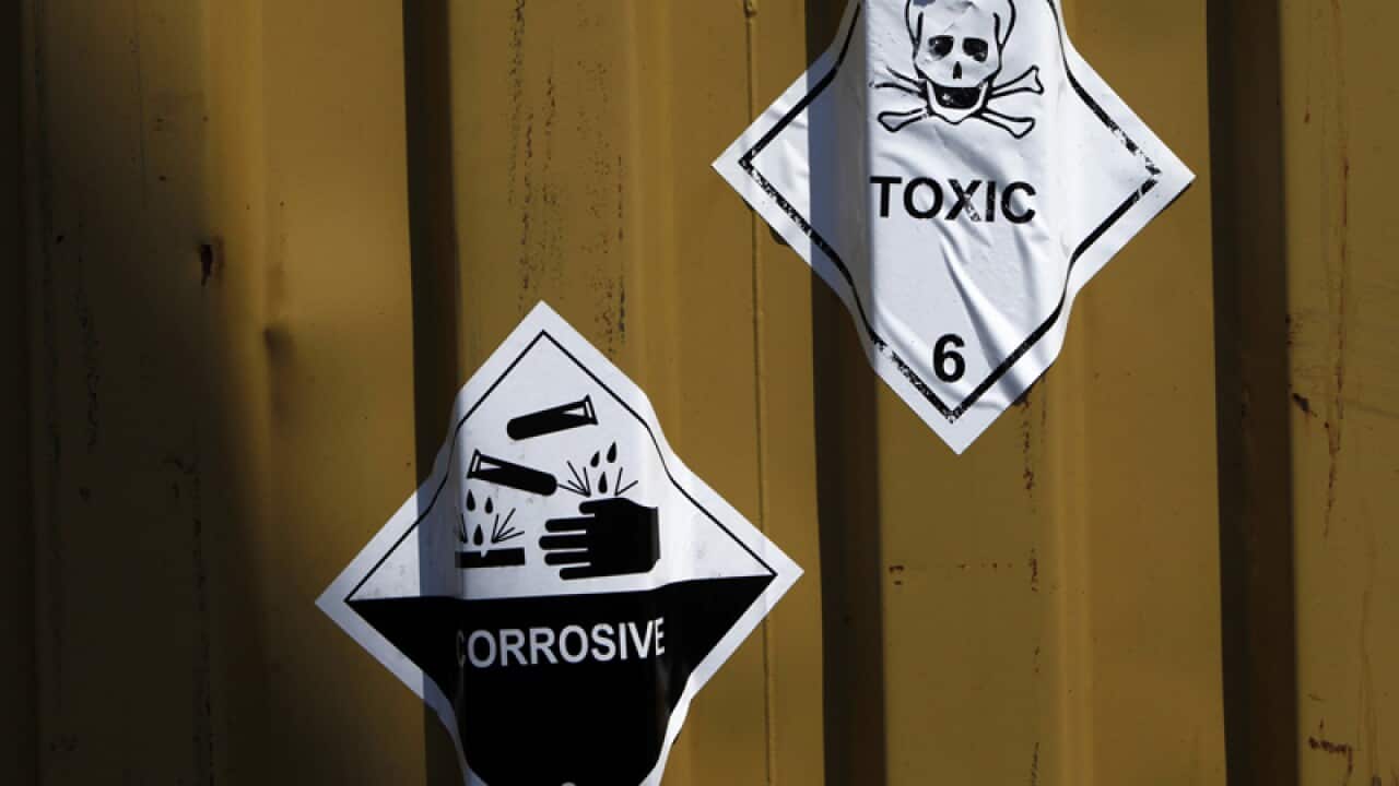 Signs reading toxic on containers carrying Syria's chemical weapons