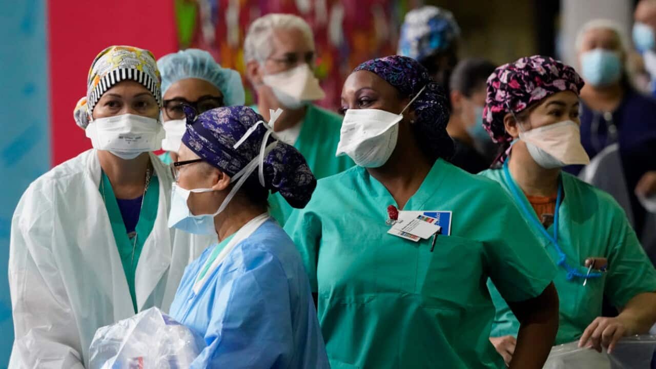 Healthcare workers line up for free personal protective equipment at Florida's Jackson Memorial Hospital, 22 September.