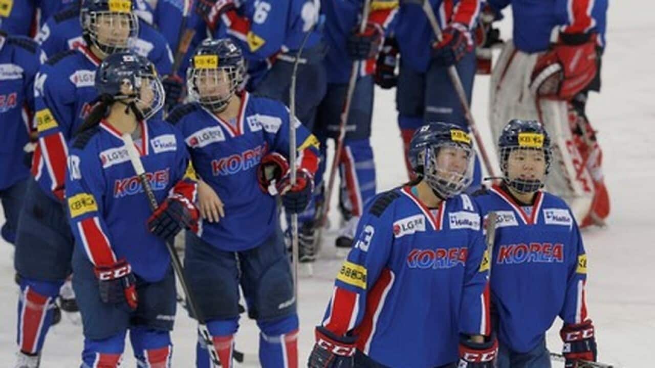South Korean women's ice hockey player Marissa Brandt skates with her teammates after a game at Quinnipiac University in Hamden