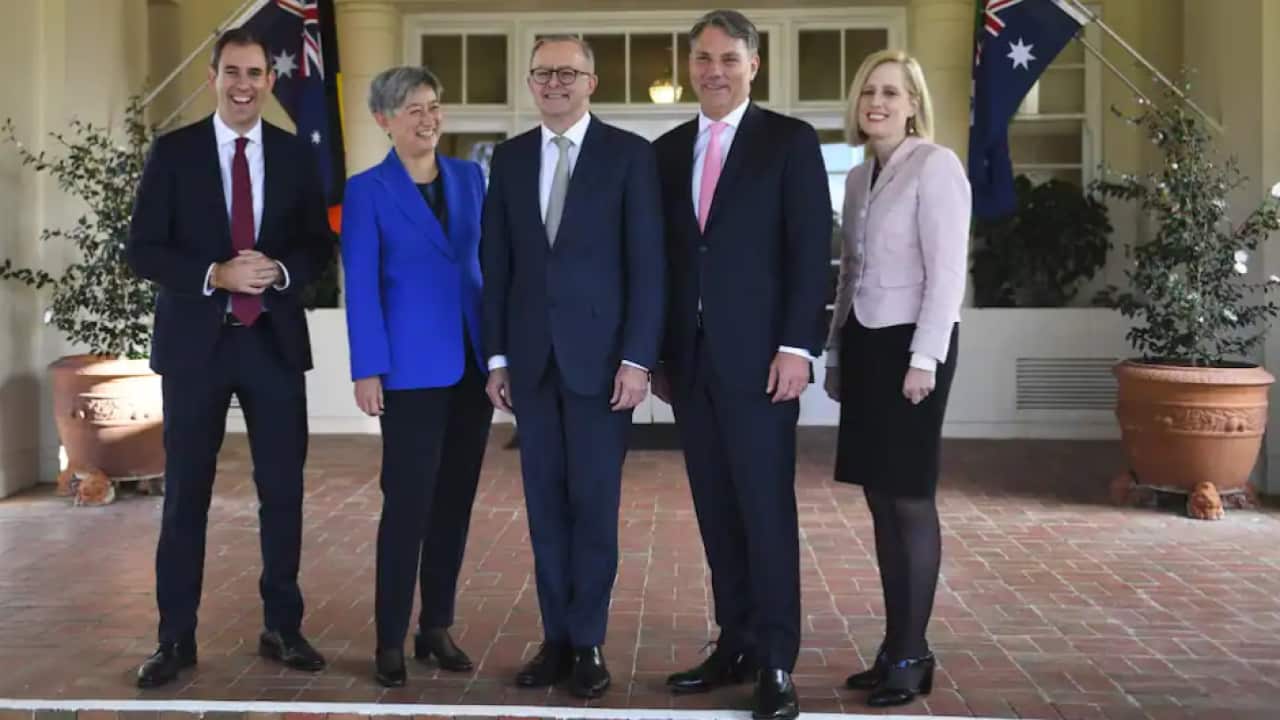 Australian Prime Minister Anthony Albanese (centre) poses for photographs with interim ministers (to left) Treasurer Jim Chalmers and Foreign Minister Penny Wong and (to right) Deputy Prime Minister Richard Marles and Finance Minister Katy Gallagher after
