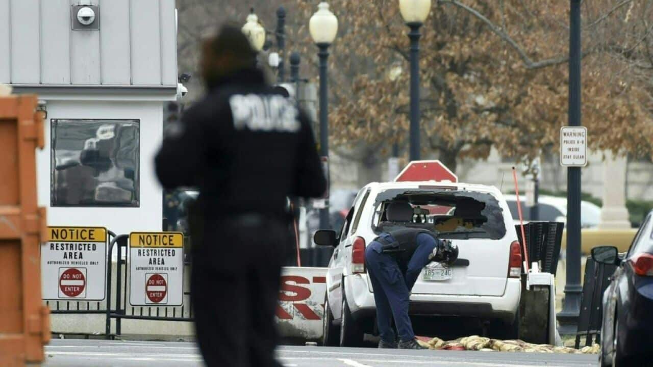 A passenger car sits at a security barrier it appears to have struck near the White House in Washington, DC on 23 February, 2018.