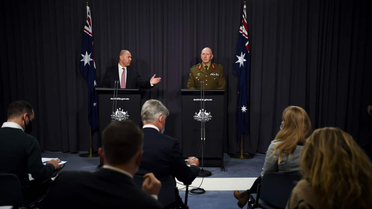Australian Treasurer Josh Frydenberg (left) and COVID-19 Taskforce Commander, Lieutenant General John Frewen speak to the media during a press conference at Parliament House in Canberra, Wednesday, July 7, 2021. (AAP Image/Lukas Coch) NO ARCHIVING
