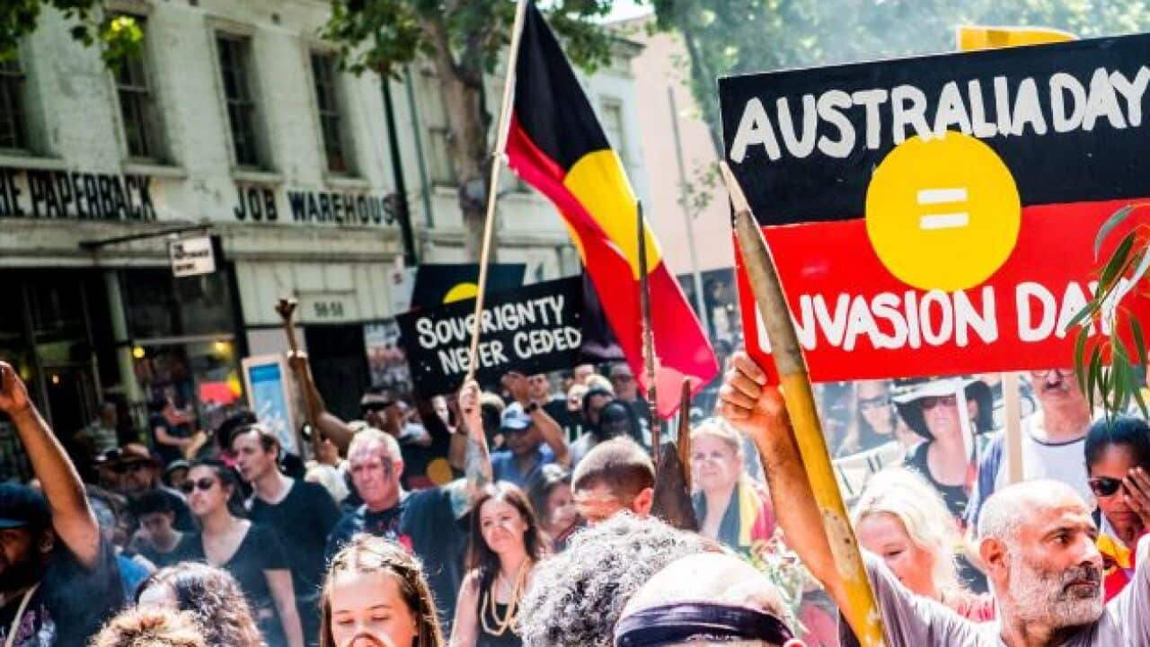 Protesters march during a protest by Aboriginal rights activist on Australia Day in Melbourne this year 2018.