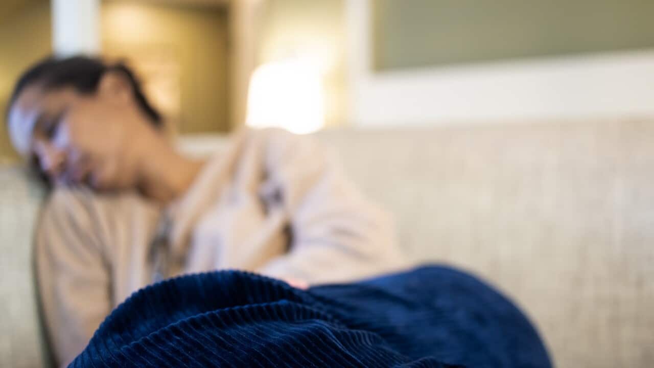 black woman napping on sofa
