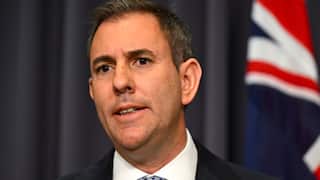 A man wearing a black suit