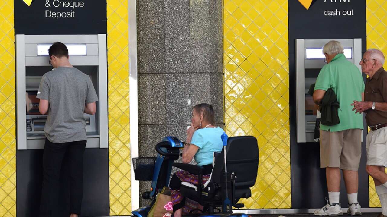 Customers using Commonwealth Bank ATMs