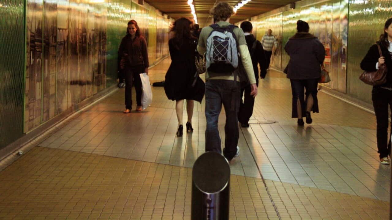 People walking through Central Station railway tunnel in Sydney, June 27, 2008. (AAP Image/Melanie Foster) NO ARCHIVING