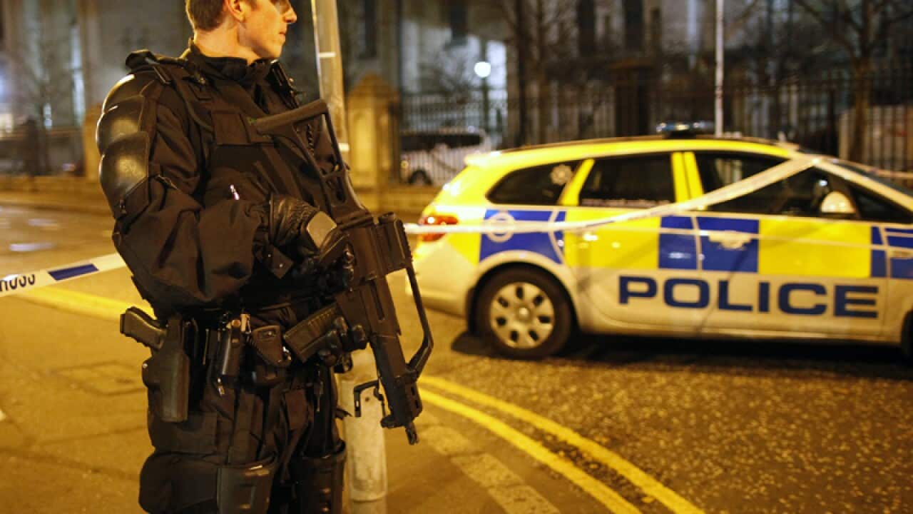 A police officer secures the area close to an explosion in Belfast.