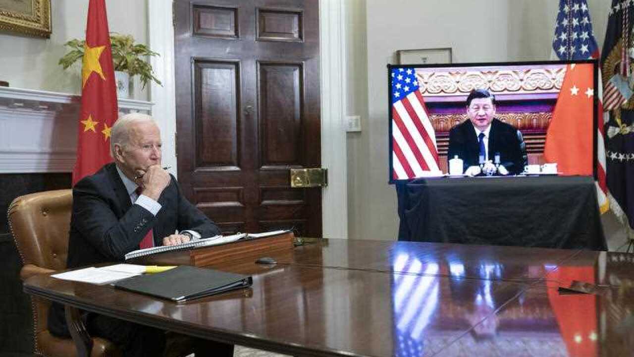 President Joe Biden listens during a virtual summit with Chinese President Xi Jinping in the Roosevelt Room of the White House in Washington DC on Monday, November 15, 2021.
