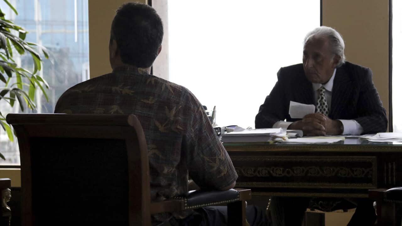 Honolulu attorney Michael Green (right) with his client, the former Hawaii Emergency Management Agency employee who sent a false missile alert.