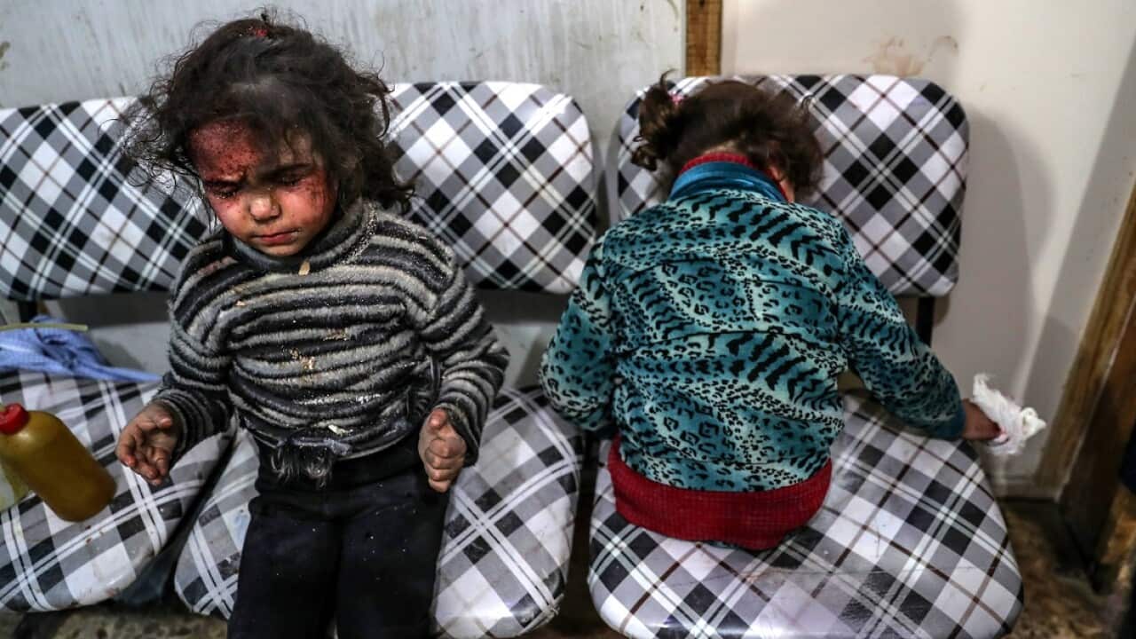 Injured children receive medical attention inside a hospital after bombing, rebels-held Douma, Eastern Ghouta, on 22 February 2018.