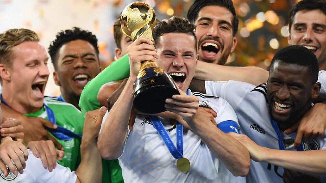 Germany's midfielder Julian Draxler lifts the trophy after winning the 2017 Confederations Cup