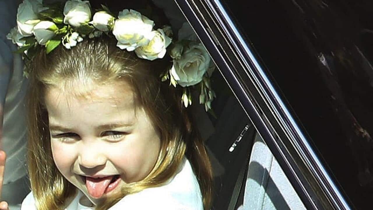 Royal bridesmaid Princess Charlotte sticks out her tongue