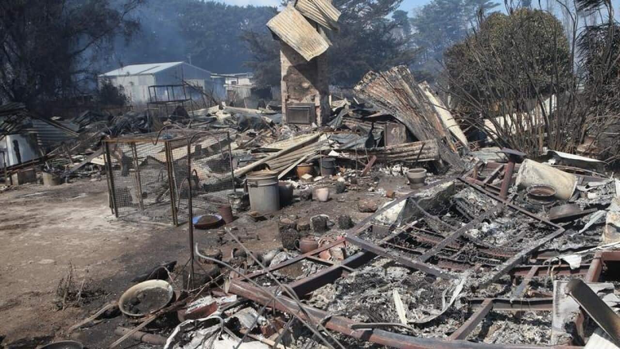 A house is seen destroyed following bushfires south of Cobden