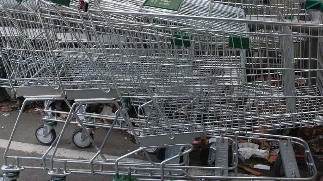Shopping trolleys outside a supermarket