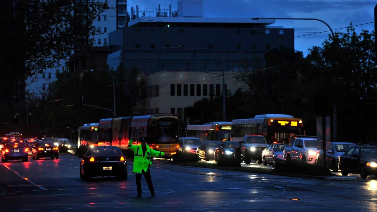 Police direct traffic around the CBD in Adelaide after the power network stopped working in 2016