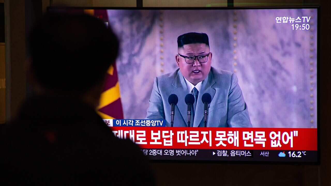 South Koreans watch North Korean leader Kim Jong Un giving a speech during the North Korea's apparent military parade, at a station in Seoul, South Korea.