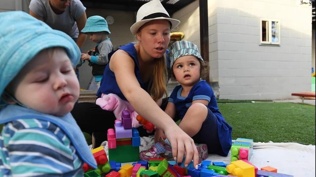 A childcare worker with children