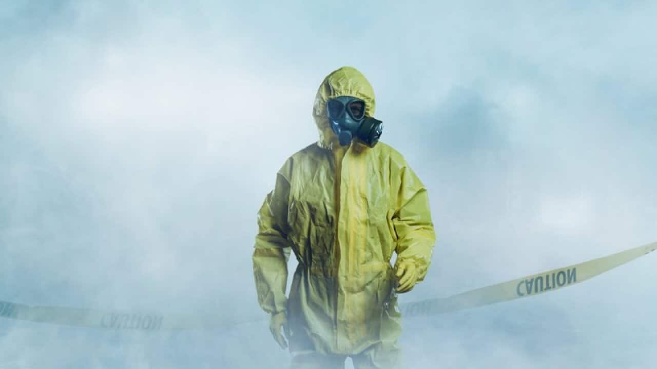 Worker in protective suit