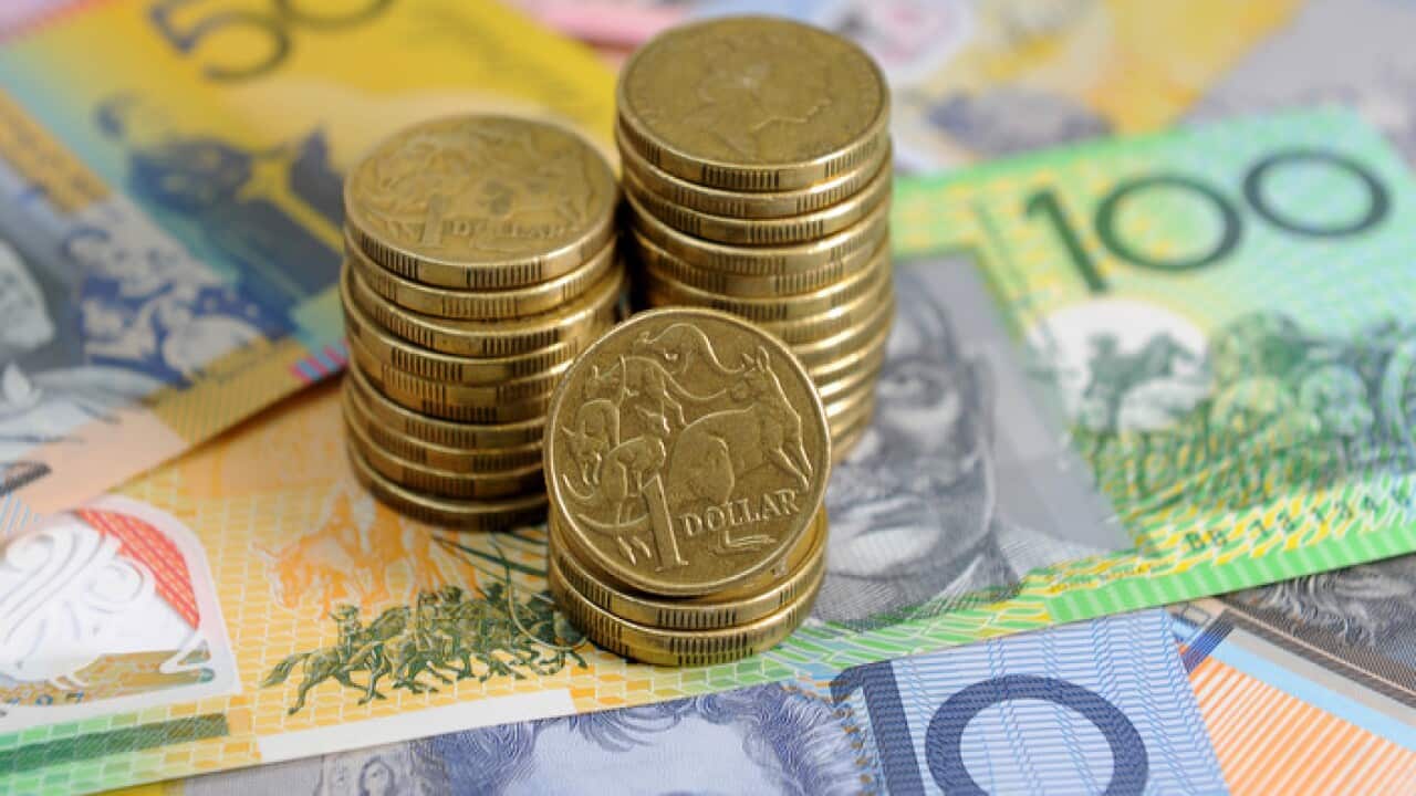 Australian dollars in Sydney, Friday, Jan. 15, 2016. (AAP Image/Joel Carrett) NO ARCHIVING