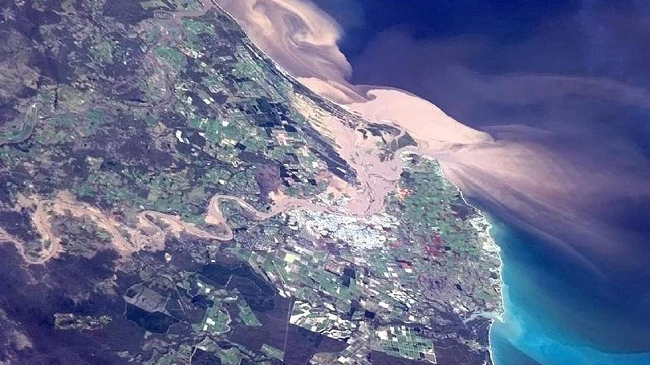 A flood plume from the Burnett River moving out into the coast