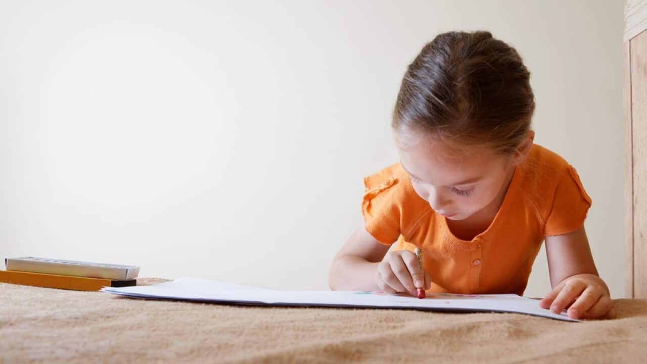 Little girl colouring in