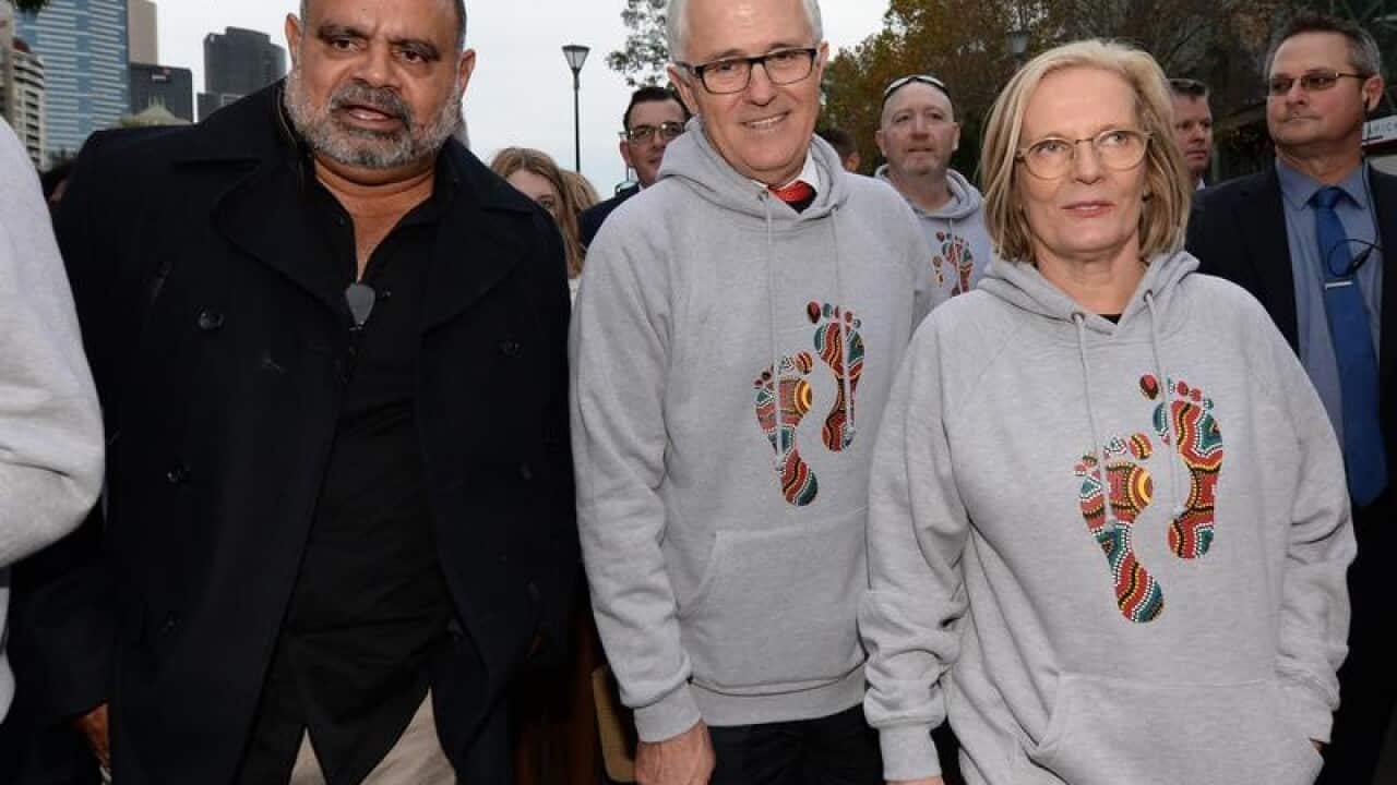 Michael Long (L) with Malcolm and Lucy Turnbull during the Long Walk