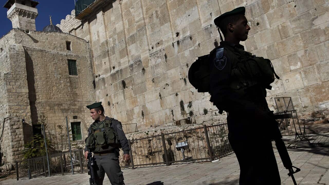 File photo showing Israeli border police stand guard on the site known to Jews as the Tomb of the Patriarchs, and to Muslims as the Ibrahimi Mosque.