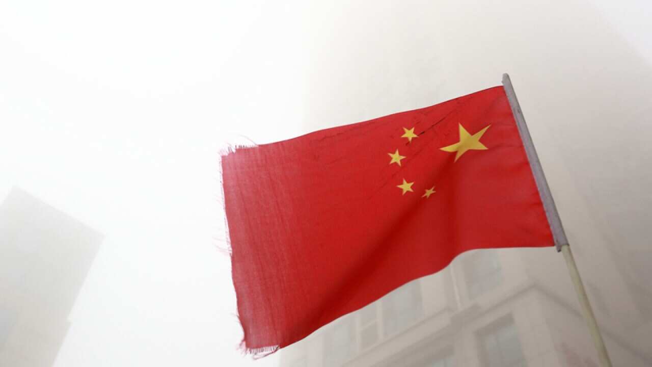 A Chinese national flag flutters in CBD in Binzhou city,