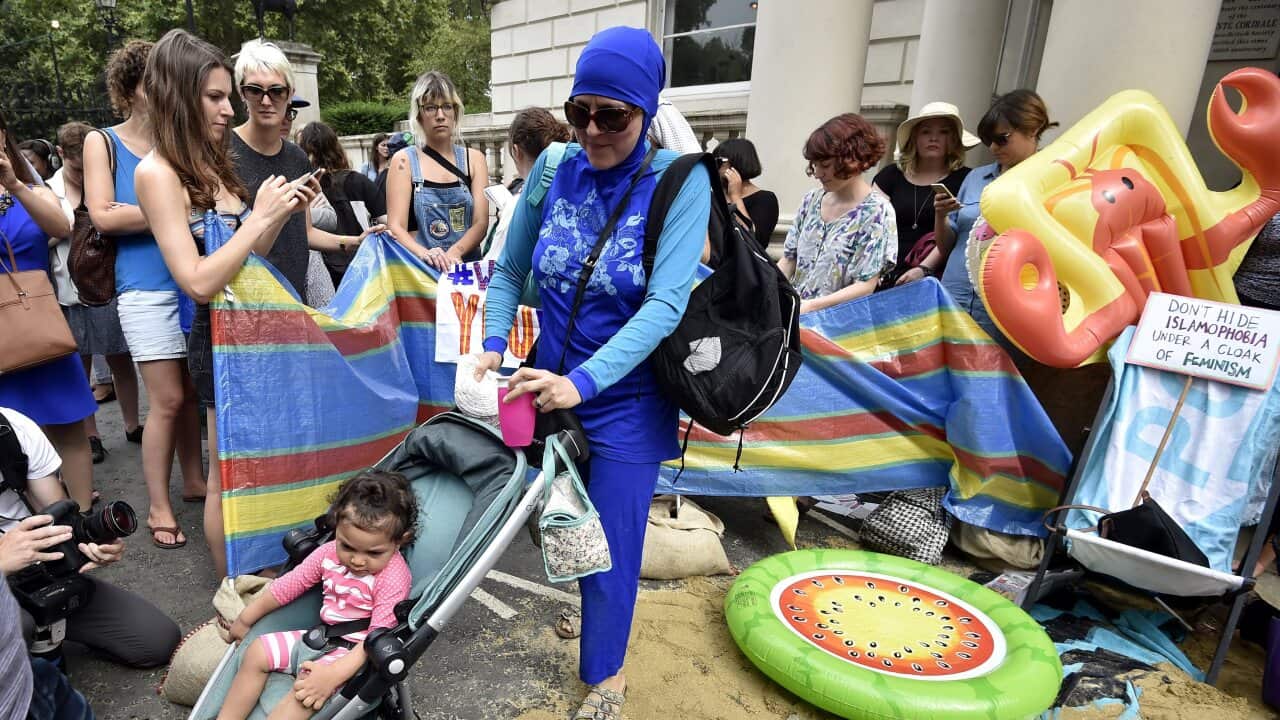 A group of people take part in a protest.