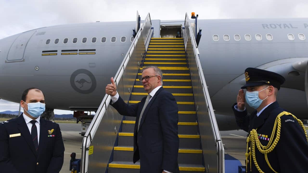 Australian Prime Minister Anthony Albanese boards the plane to Japan to attend the QUAD leaders meeting in Tokyo, Canberra, Monday, May 23, 2022. (AAP Image/Lukas Coch) NO ARCHIVING
