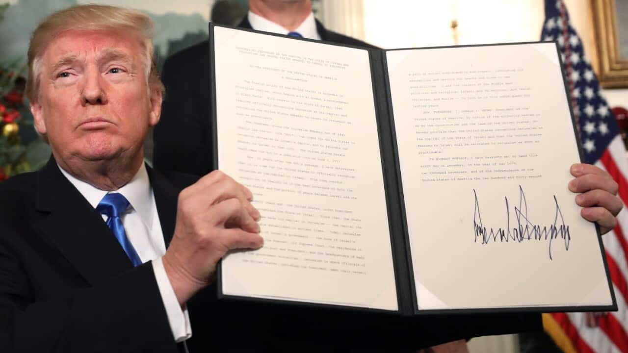 US President Donald J. Trump signs his proclamation about his controversial decision to formally recognise Jerusalem as the capital of Israel
