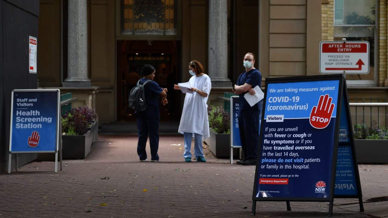 Staff wearing face masks outside the Royal Prince Alfred Hospital in Camperdown, Sydney.