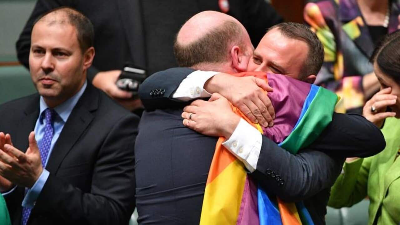 Trent Zimmerman and Tim Wilson celebrate