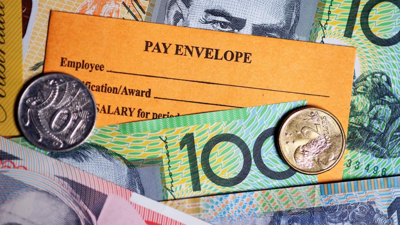 A stock photograph of Australian currency and a wages envelope