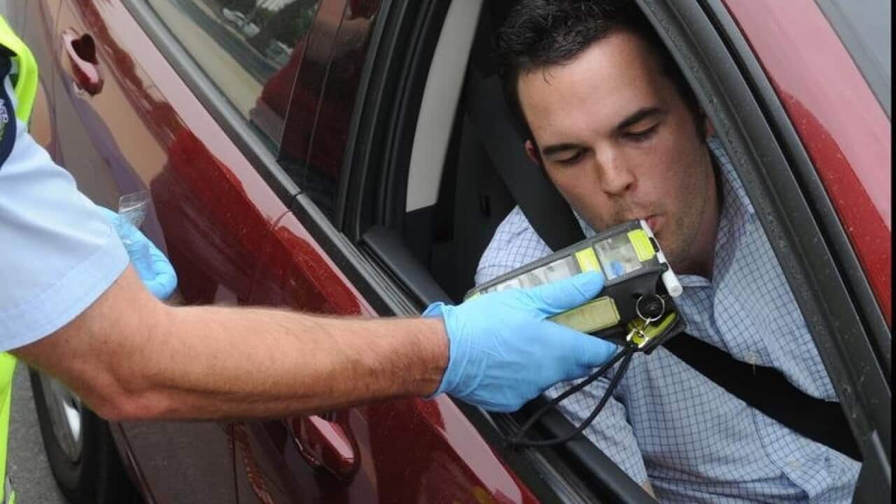 Victoria police conduct a roadside alcohol breath test