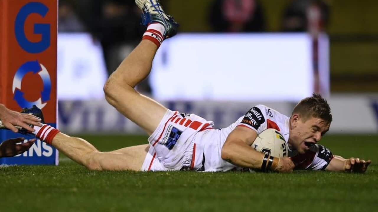 Mathew Dufty of the Dragons scores a try.