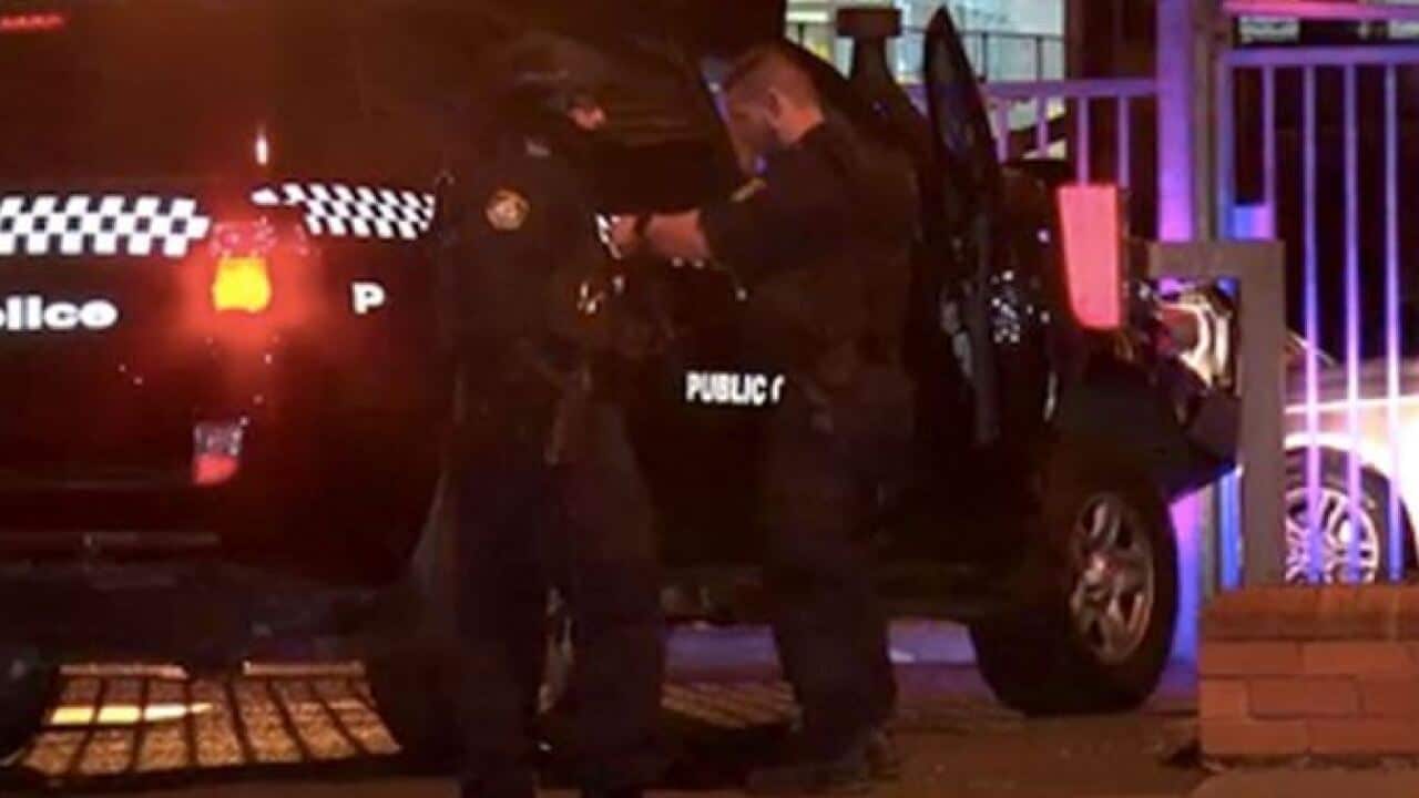 A man has been shot dead outside a western Sydney police station after he opened fire on officers with a shotgun, injuring one.