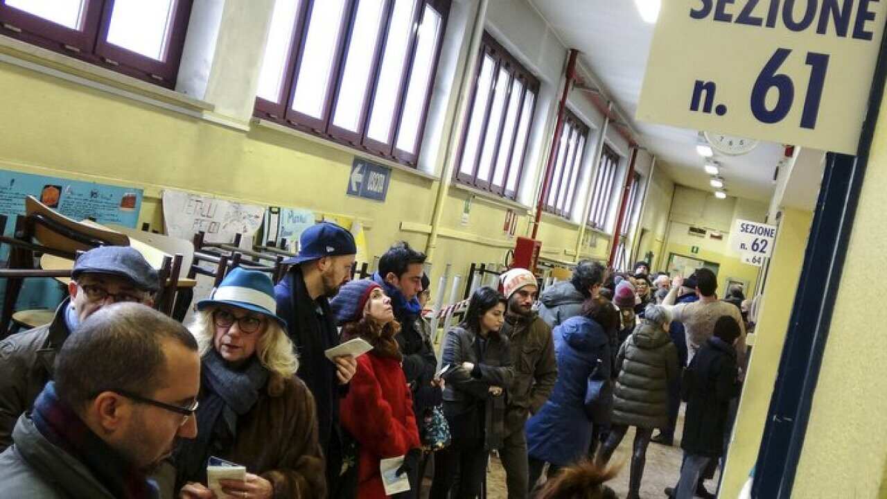 People line up to vote for general elections on March 4, 2018
