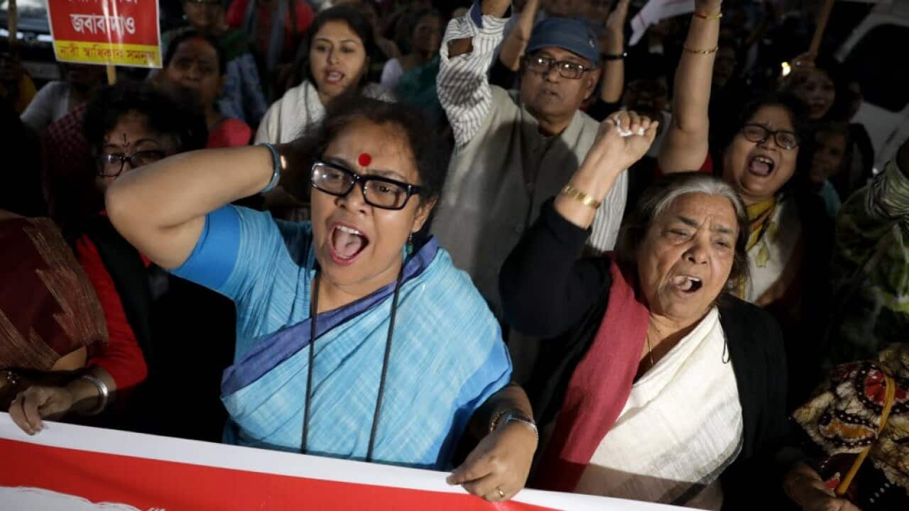 Indian activists hold placards during a rally against rape cases in Kolkata, Eastern India, 5 December 2019.