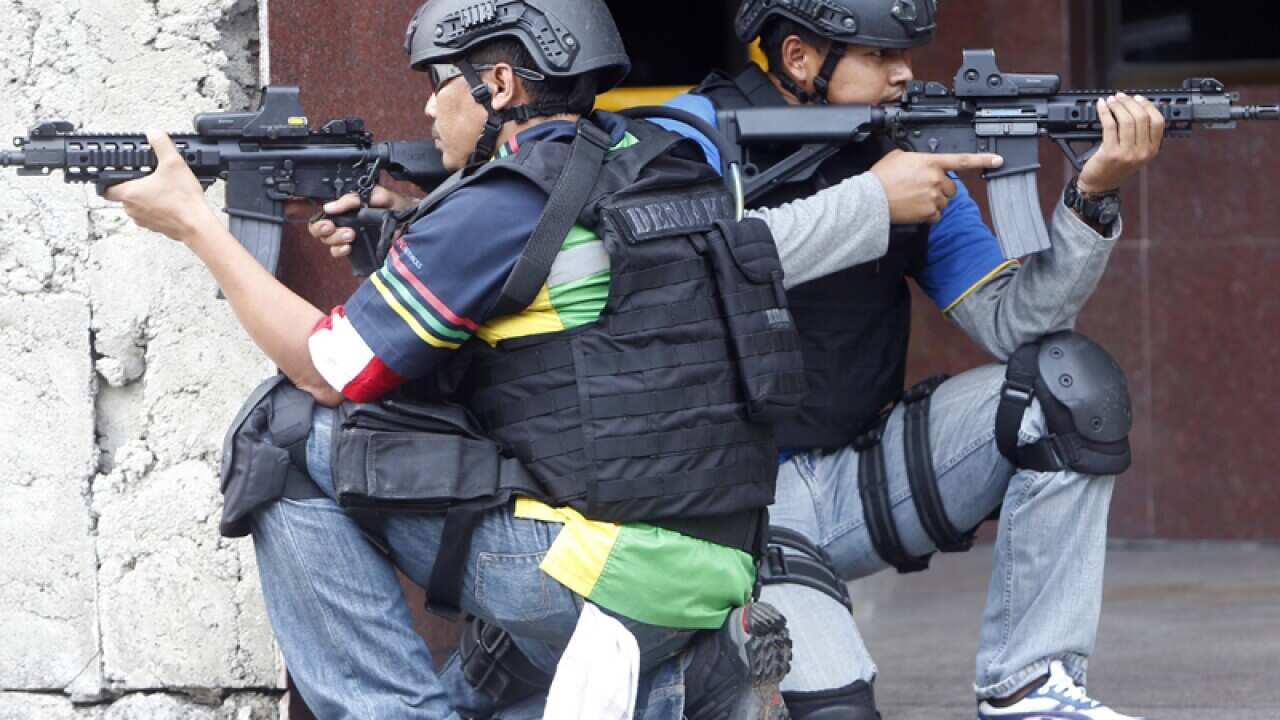 Two Indonesian navy seals 'Denjaka,' in civilian clothes